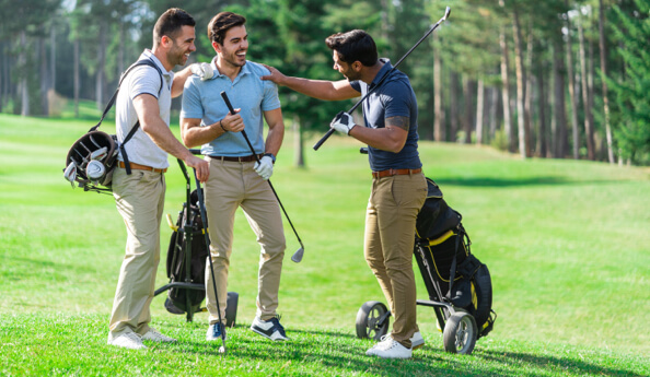 3 people playing golf